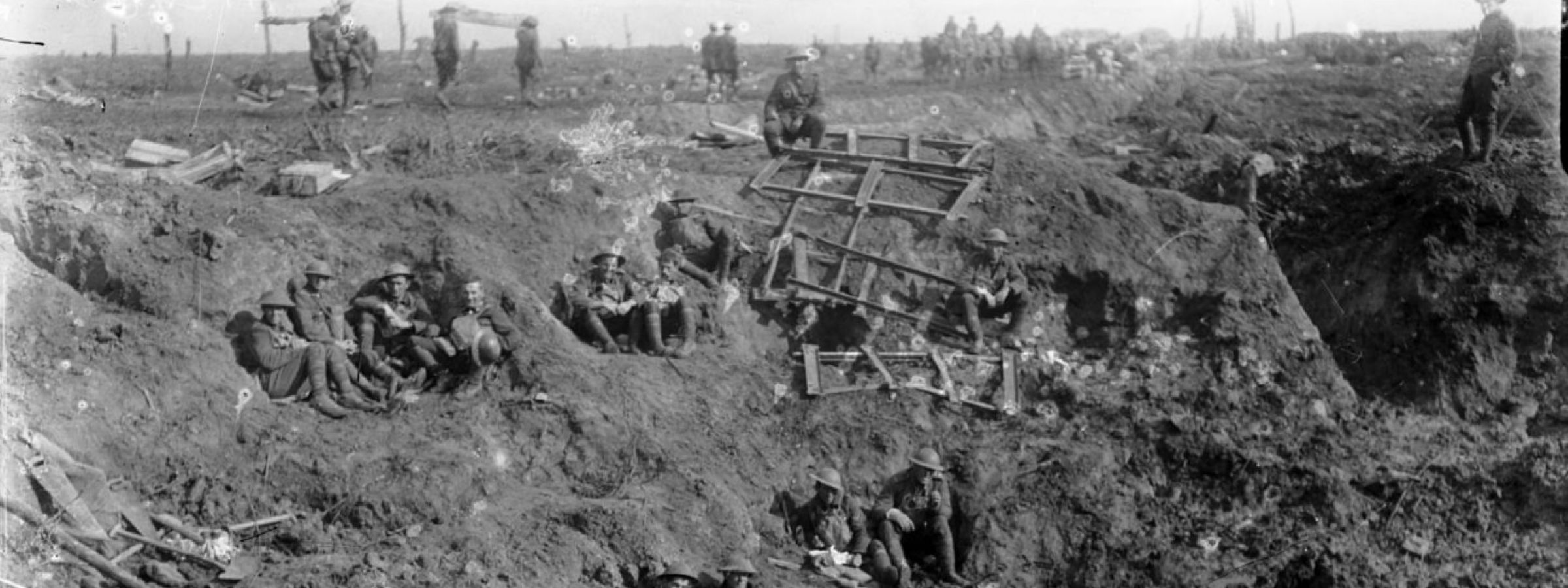New Zealand Engineers resting in a large shell crater at Spree Farm, Ypres Salient, 12 October 1917.